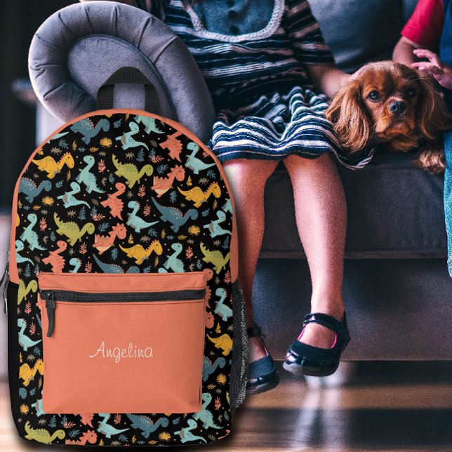 Colourful dinosaur pattern orange black name  printed backpack (Creator Uploaded)