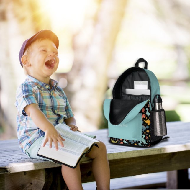 Colourful dinosaur pattern turquoise black name  printed backpack (Creator Uploaded)