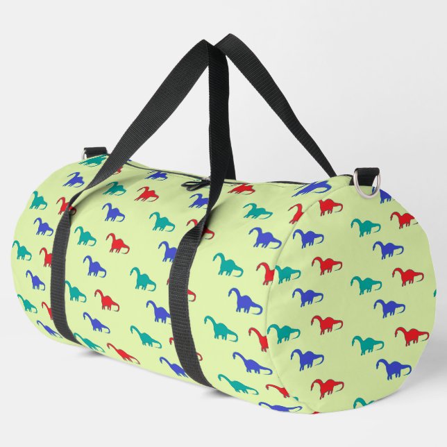 Colourful dinosaurs pattern on green duffle bag (Left Corner)