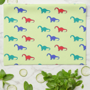 Colourful dinosaurs pattern on green tea towel