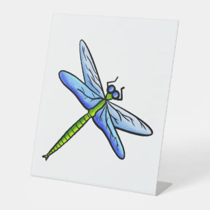 Colourful dragonfly on a branch pedestal sign