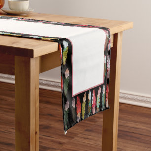 Colourful feathers on black short table runner