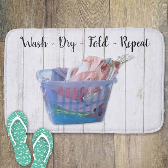 Colourful Folded Laundry On Hangers In Blue Basket Bath Mat (Creator Uploaded)