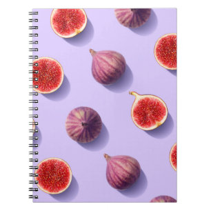 Colourful fruit pattern of fresh figs on purple pa notebook