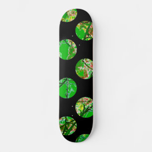 Colourful green circles on black skateboard