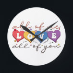Colourful Heart Love Quote Round Clock<br><div class="desc">Express deep love and connection with this beautiful “All of Me Loves All of You” design. Featuring vibrant heart-shaped letters, soft floral accents, and elegant handwritten typography on a dark background, this artwork is perfect for couples, anniversaries, Valentine’s Day, weddings, or romantic gifts. Its warm, heartfelt message makes it ideal...</div>