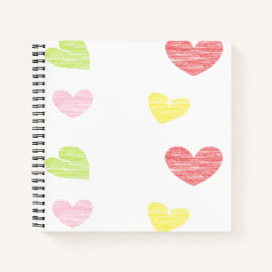 Colourful hearts on white notebook