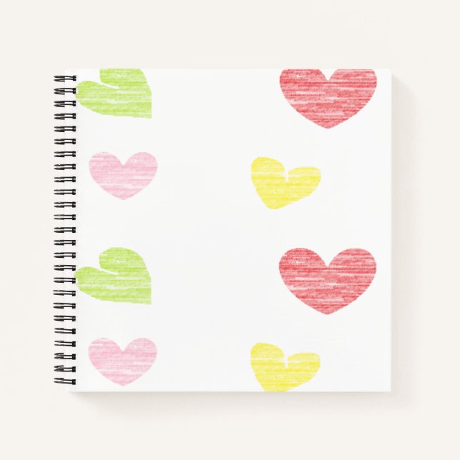 Colourful hearts on white notebook (Front)