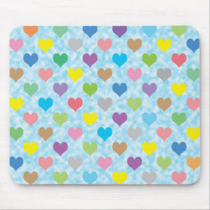 Colourful hearts pattern on blue background mouse pad
