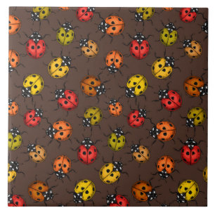 Colourful ladybugs on brown ceramic tile