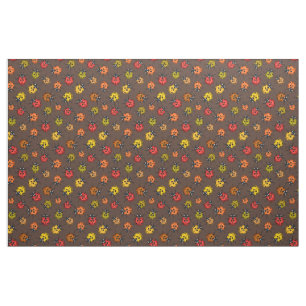 Colourful ladybugs on brown fabric