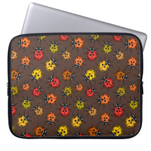 Colourful ladybugs on brown laptop sleeve