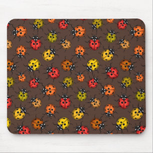 Colourful ladybugs on brown mouse pad