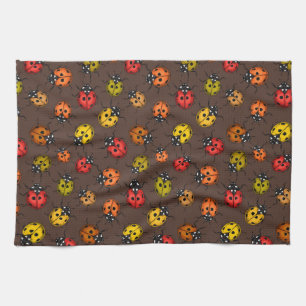 Colourful ladybugs on brown tea towel