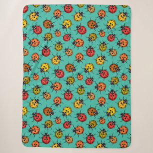 Colourful ladybugs on turquoise sherpa blanket
