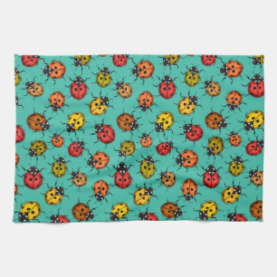 Colourful ladybugs on turquoise tea towel