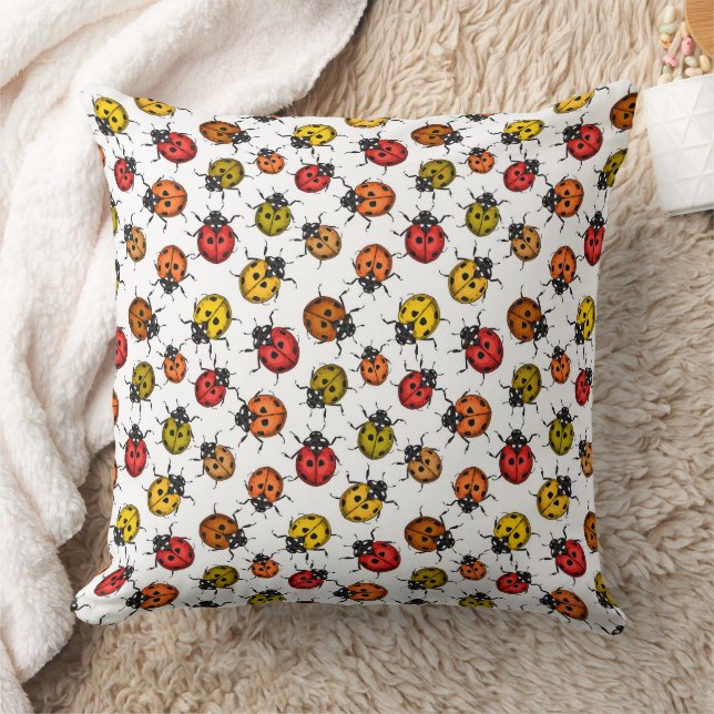 Colourful ladybugs on white cushion (Blanket)