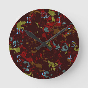 Colourful leaves and flowers against camouflage round clock