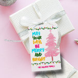 Colourful Merry Bright Pink Christmas Tree Party Gift Tags<br><div class="desc">Cute and cheerful holiday gift tags featuring a colourful strand of Christmas lights wrapped around your vibrant script. May Your Days Be Merry and Bright written in bold letters from light blue to your family name in hot pink. A rainbow of colours on cute present tags for the holidays with...</div>