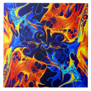 colourful mix of neon paints swirling on black   ceramic tile