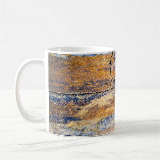 Colourful natural stone wall pattern in a quarryan coffee mug