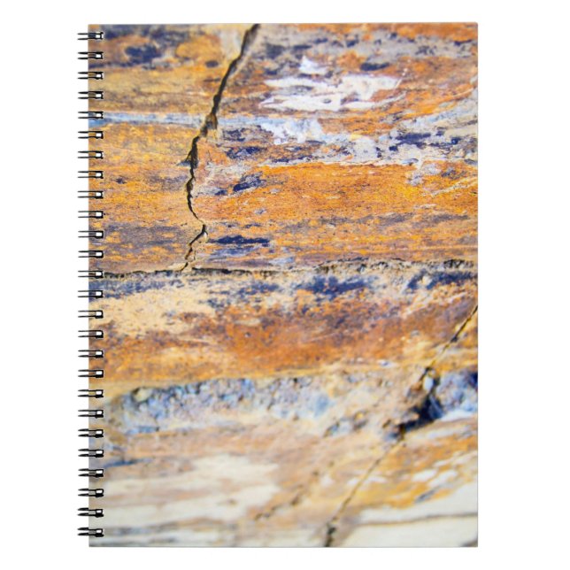 Colourful natural stone wall pattern in a quarryan notebook (Front)