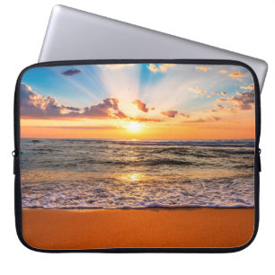 Colourful ocean beach sunrise with deep blue sky a laptop sleeve