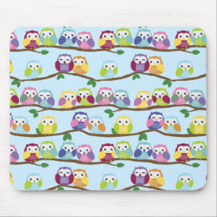 Colourful owls on a branch mouse pad