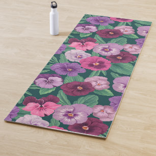 Colourful pansies on dark greenish blue yoga mat