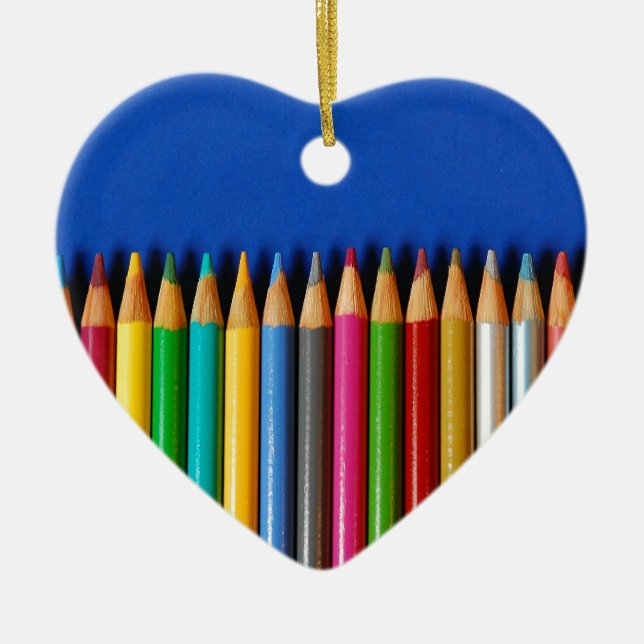 Colourful pencil crayons on blue background ceramic ornament (Front)