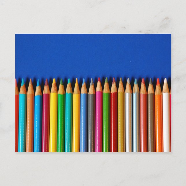 Colourful pencil crayons on blue background postcard (Front)