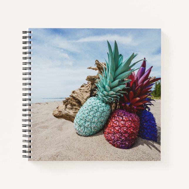 Colourful Pineapples on a Sandy Beach Notebook (Front)