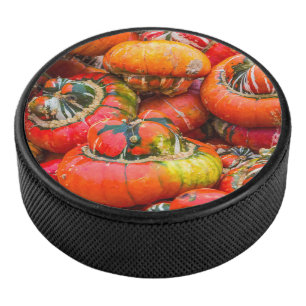 Colourful pumpkins hockey puck