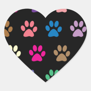 Colourful puppy paw prints on black heart sticker