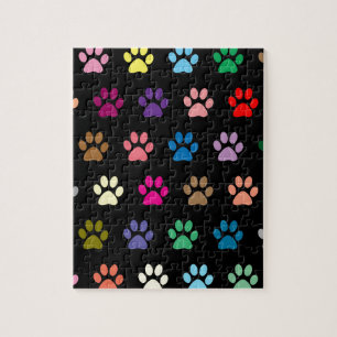 Colourful puppy paw prints on black jigsaw puzzle