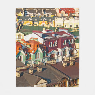 Colourful roofs in winter in Kiev, Ukrainevariegat Fleece Blanket