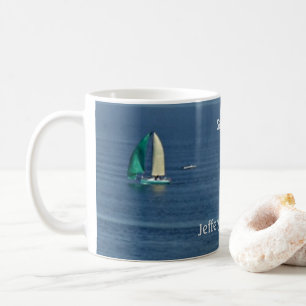 Colourful sailboats on the ocean sail on coffee mug