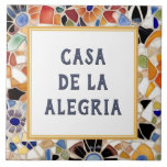 Colourful Spanish Mosaic Custom House Name Plate Ceramic Tile<br><div class="desc">Please note: This is a faux mosaic. It is a printed graphic giving the illusion of mosaic stones. "custom house name plate", "personalised house name plaque", "personal customised text sign", "modern abstract design ceramic tile", "multicolored colourful gaudi mosaic", "building group home name art", "bright vibrant yellow blue", "last family name...</div>