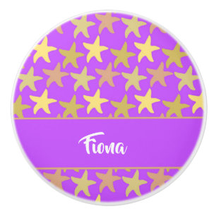 Colourful starfish on purple ceramic knob