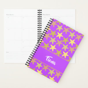 Colourful starfish on purple planner