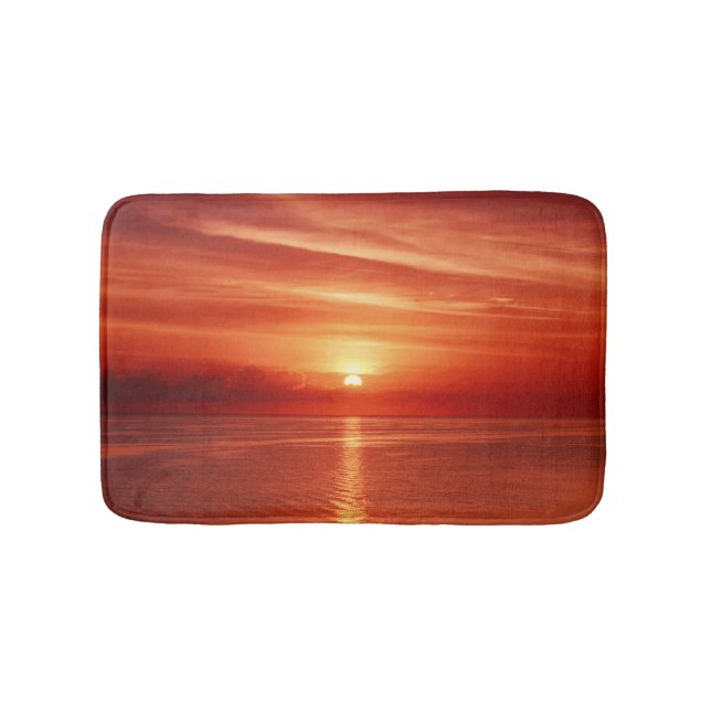 Colourful sunrise at sea, dramatic clouds. bath mat (Front)