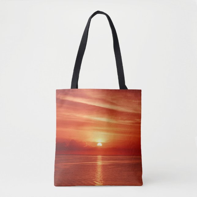 Colourful sunrise at sea, dramatic clouds. tote bag (Front)