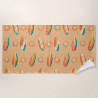 Colourful surfboards and suns against golden sand. beach towel