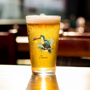 colourful toucan sitting on a  branch glass