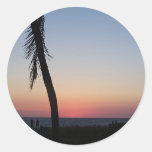 Colourful tropical sunset on a classic round sticker
