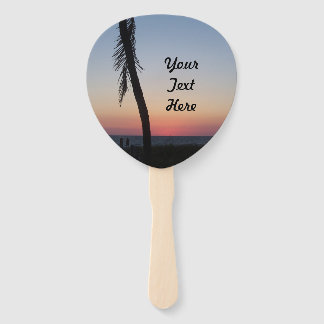 Colourful tropical sunset on handheld fans