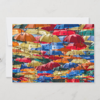 Colourful umbrellas in the sky blue orange red invitation