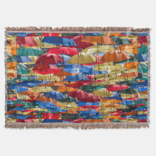 Colourful umbrellas in the sky blue orange red throw blanket