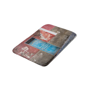 Colourful wall with blue door bath mat