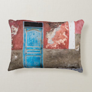 Colourful wall with blue door decorative cushion